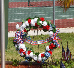 The Veteran's Club placed a memorial wreath at the base of the flag pole