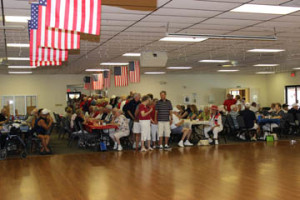 Betty Van Tassell and Tim Davis, president of the Activity Board, line up La Casa residents for the traditional Grand March.