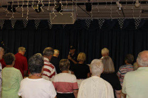 Veterans Club member Clint Van Tassell leads everyone in a moment of silence.