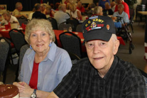 Sally and Tom Smith, a Korean War veteran, enjoy themselves at the party.