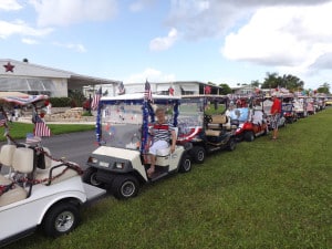 13 decorated golf carts lined up on Los Altos next to the Rec Hall before winding around La Casa's lakes.