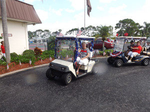 Jean Schreiber's patriotic cart drives through the Rec Hall portico.