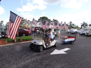 3rd place winner Ken Hutchinson, who patriotically decorated the golf cart he uses in his home tree-trimming business.