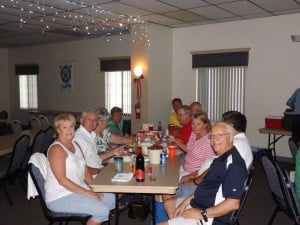 A table of happy La Casa residents enjoying the July dance.